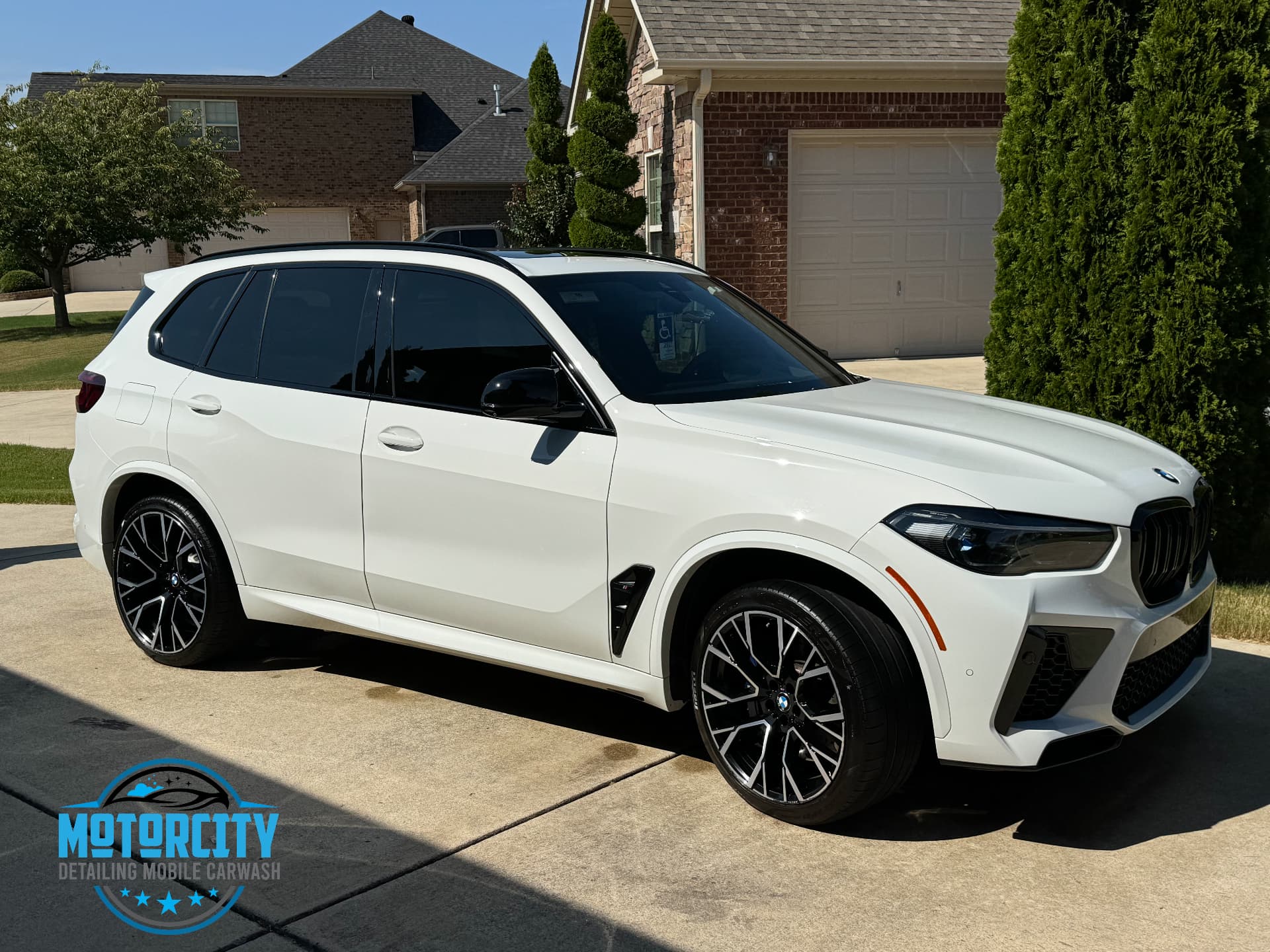 White BMW X5 M with glossy paint after a Motorcity Signature detail