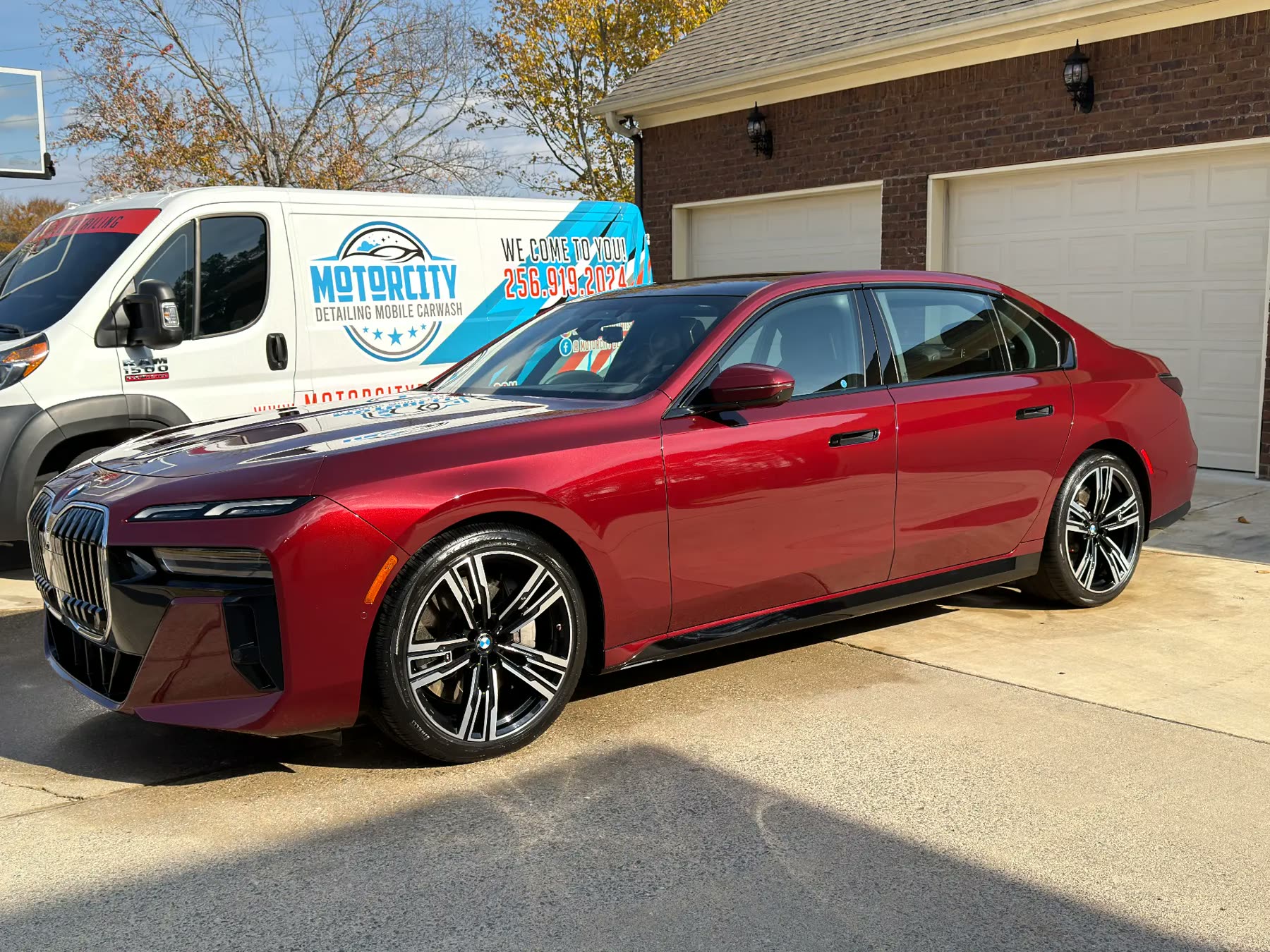 Red BMW 7 Series with a long-term ceramic coated finish